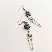 Sparkly Black Pumpkin Topped Skeleton Charm Trapeze Earrings