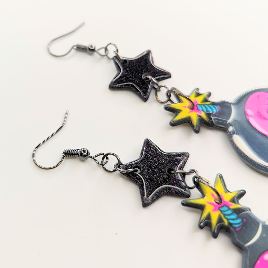 Sparkly Black Star Topped Skull Bomb Trapeze Earrings