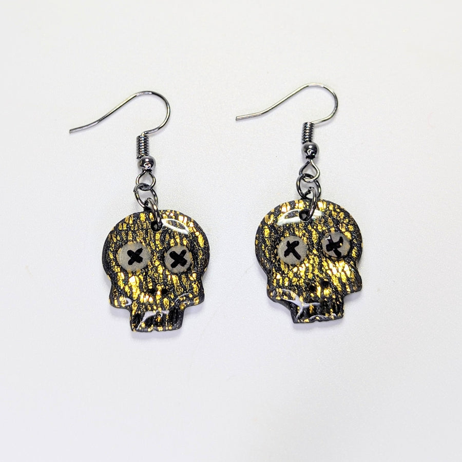 Sparkly Black & Gold Leaf Skull Stop Earrings with Glow in the Dark Eyes
