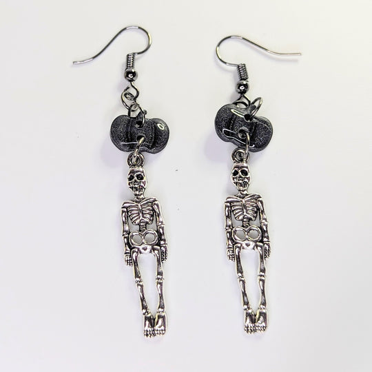 Sparkly Black Pumpkin Topped Skeleton Charm Trapeze Earrings