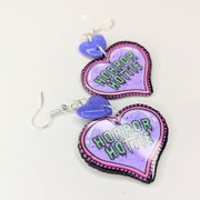 Horror Hottie Acrylic Heart with Sparkly Purple Heart Top Trapeze Earrings