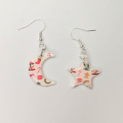 White Christmas Print Star & Moon Drop Earrings