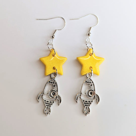 Sparkly Yellow Star with Metal Rocket Charm Trapeze Earrings